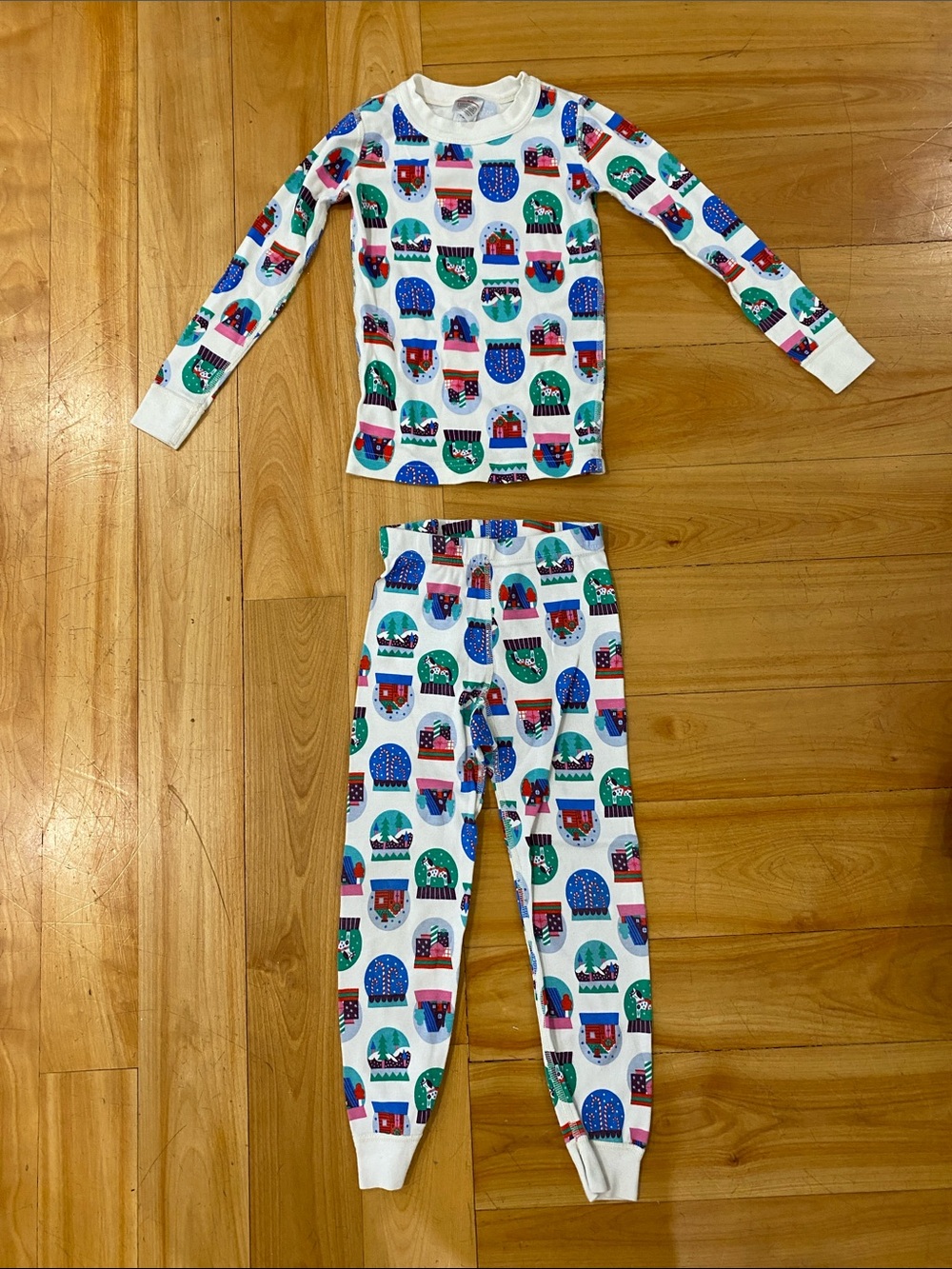Hanna Andersson White Pajama Set with Red, Blue and Green Snow Globe Print